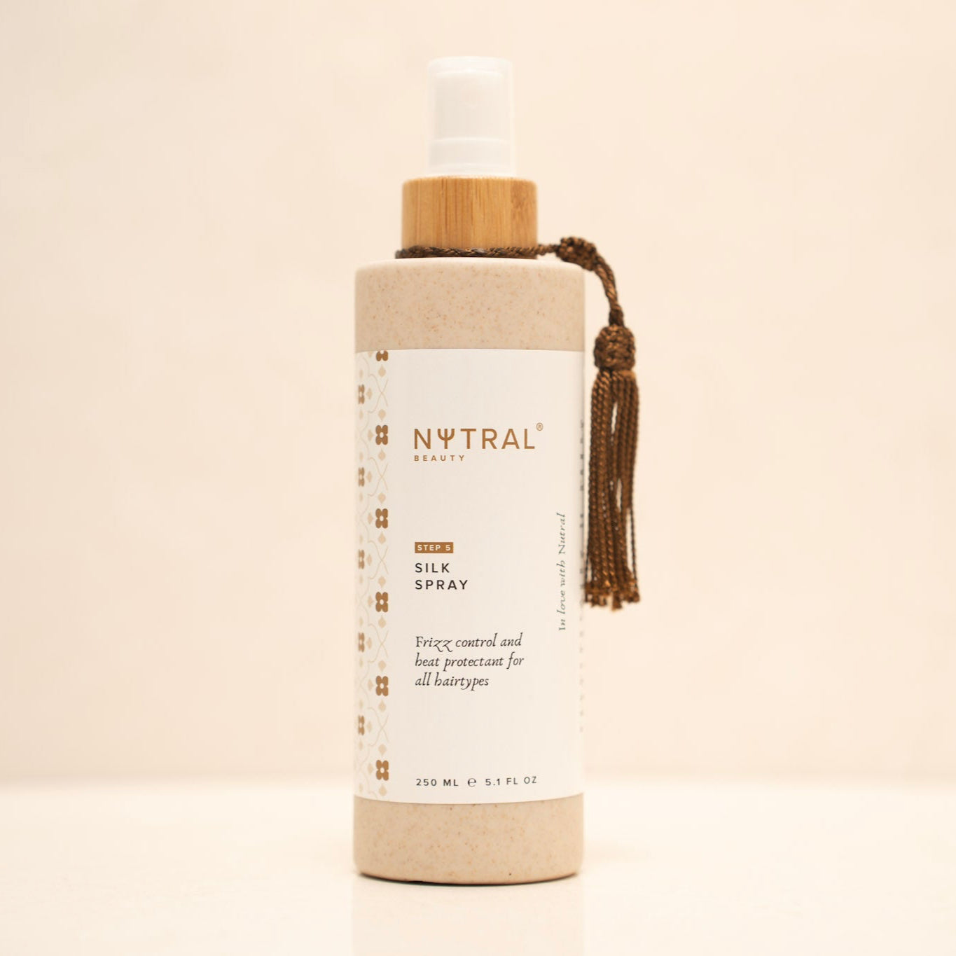 Nutral Beauty Silk Spray with organic ingredients offers frizz control and heat protection for all hair types while adding a natural shine